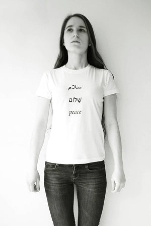 Salaam Shalom Peace in Arabic, Hebrew & English. White T-shirt with Black Writing. Simple and Minimal. Capsule Wardrobe.